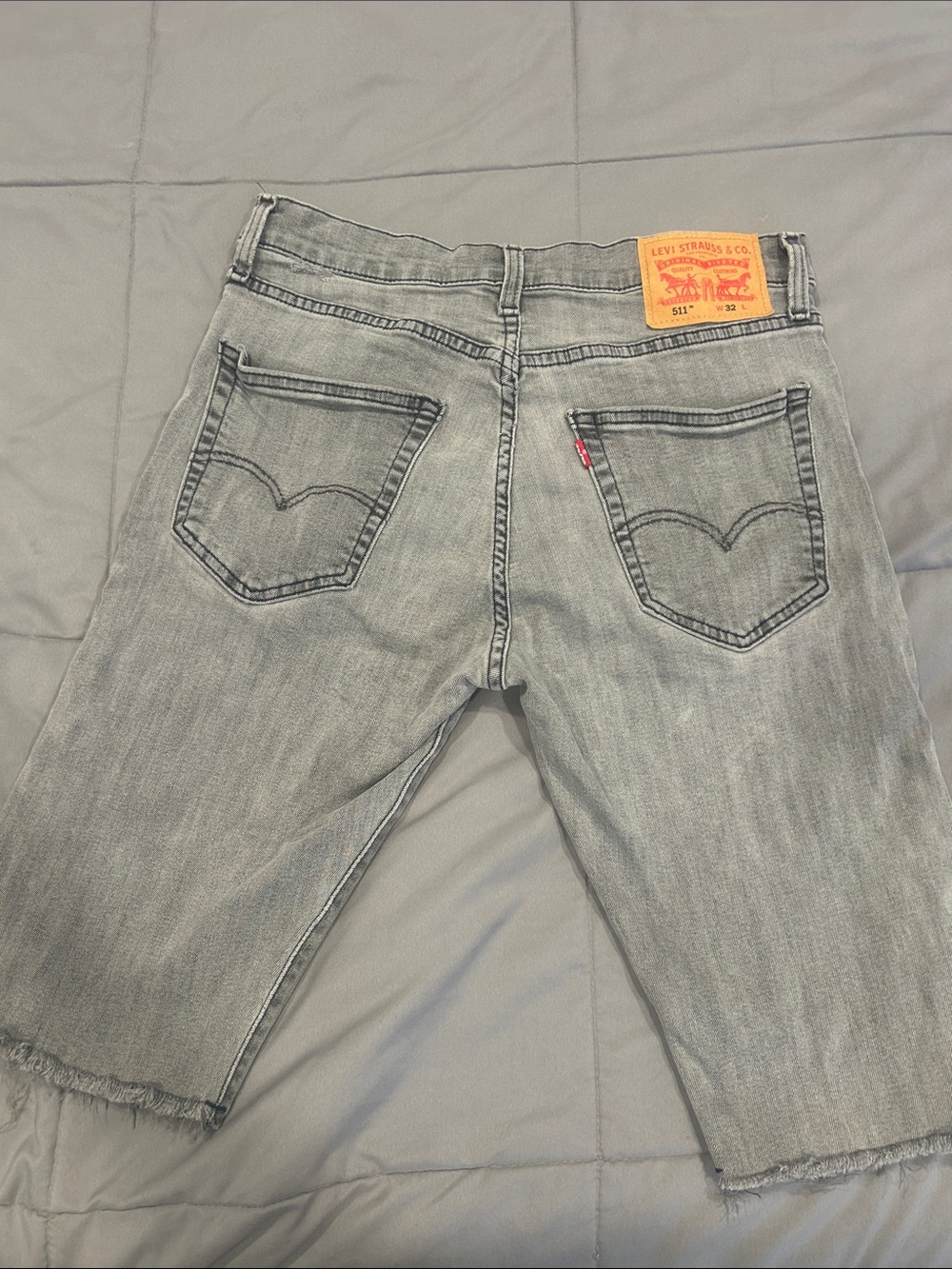 Levi's gray denim shorts with tan leather patch